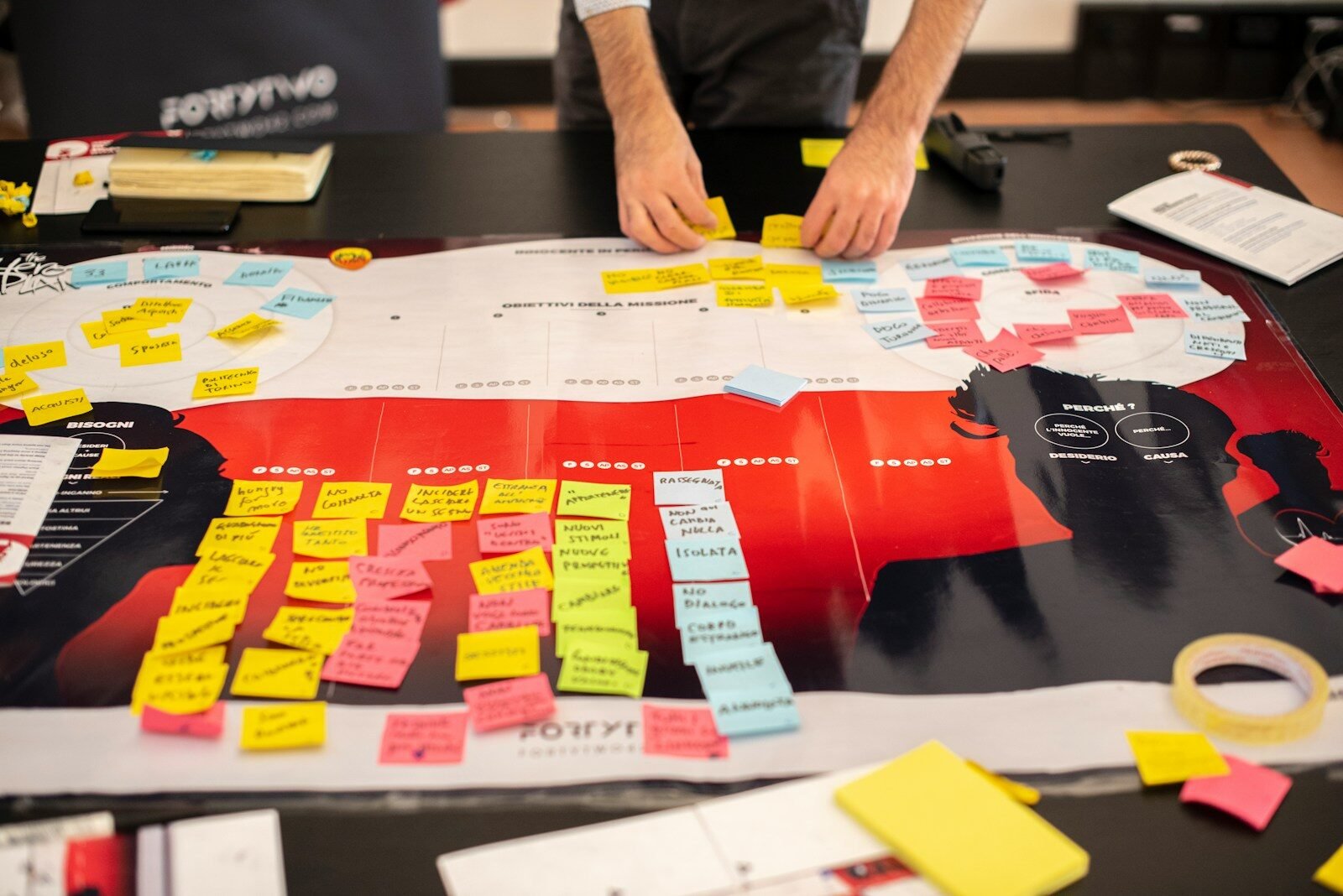Planning Ai Agents 1 - Top Ai Agent Person in black shirt holding red and white plastic pack