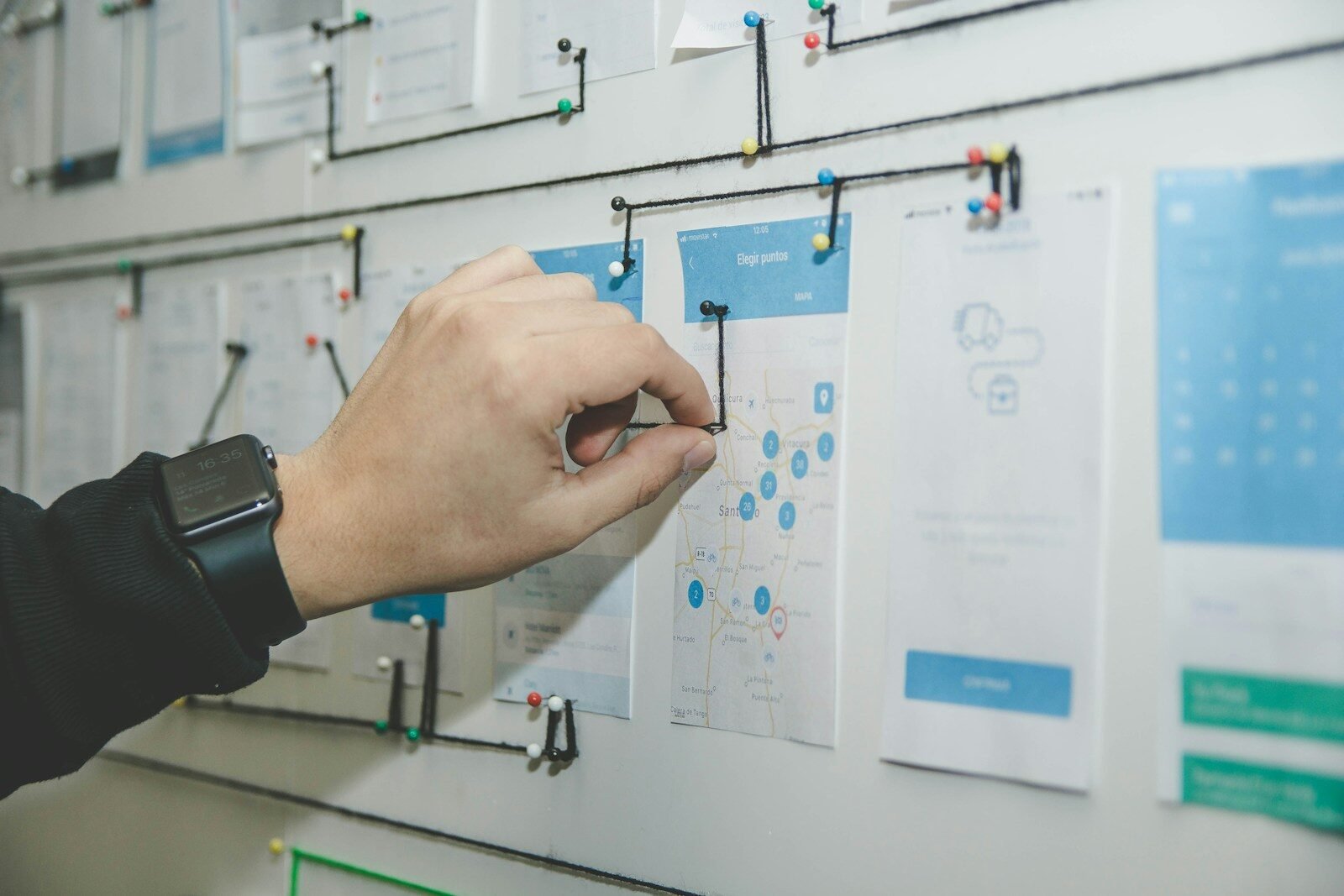 Ai Agent Workflows 1 - Top Ai Agent Person working on blue and white paper on board
